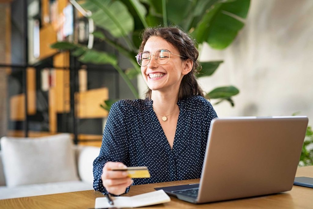 woman-with-laptop-using-credit-c
